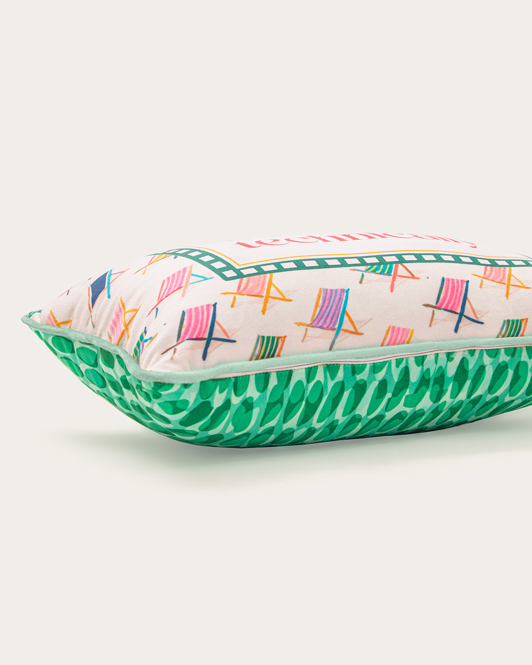 Rectangular pillow with colorful deck chair pattern on a white background