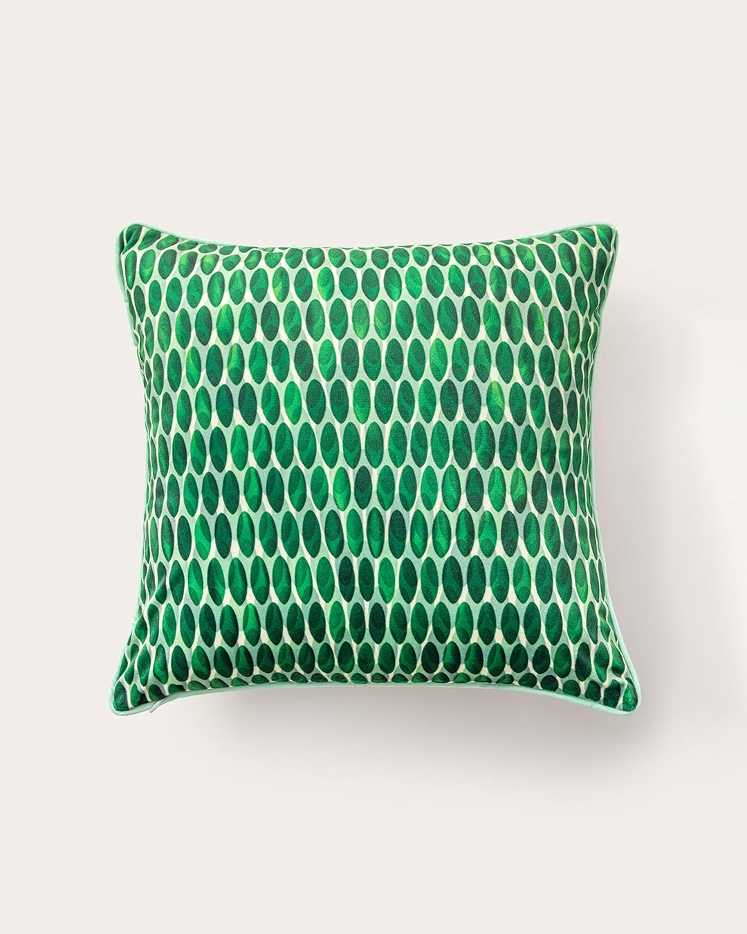 Green patterned pillow on a white background