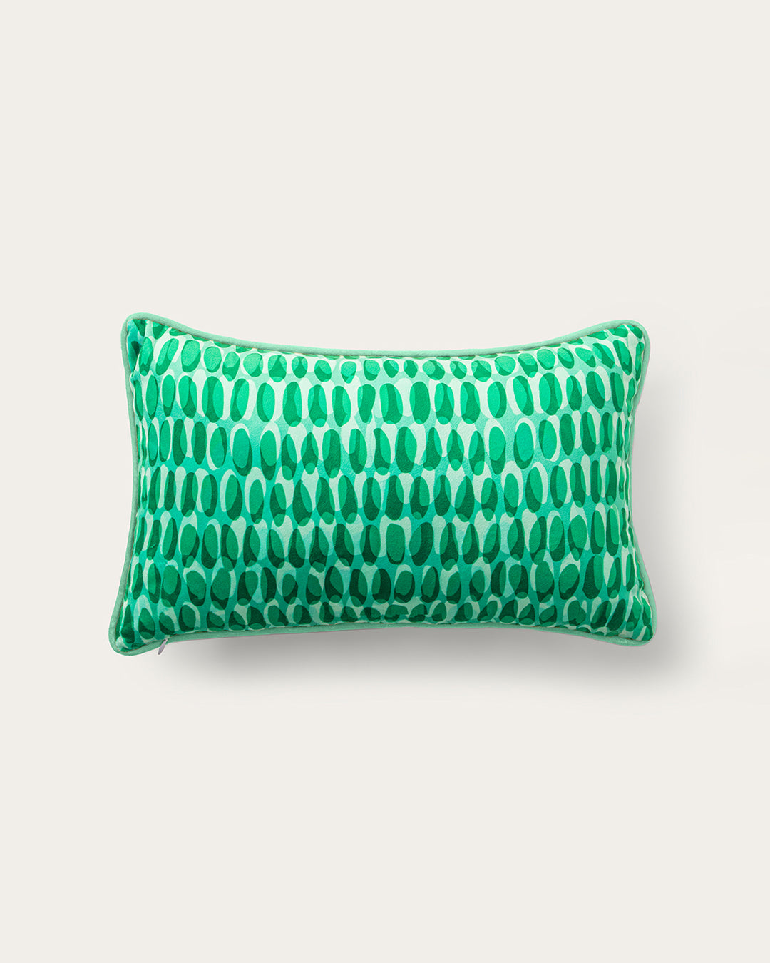 Green patterned pillow on a white background